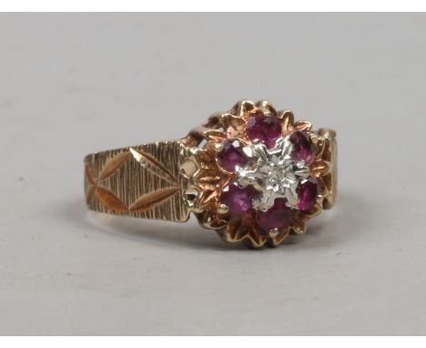 A 9ct gold ring with textured shoulders, rubies and a diamond, size M 1/2.