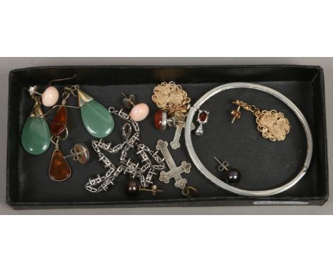 A tray of mostly silver jewellery including amber set drop earrings, crucifix, white paste set bangle etc.