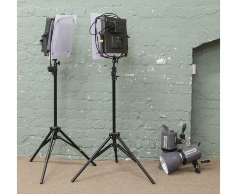 A pair of LED studio panel lights for photography on adjustable tripod stands and a pair of Interfit photo flood studio lamps