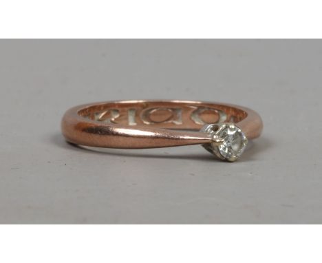 A Clogan 9ct rose gold solitaire diamond ring, approximately 0.1ct size K.