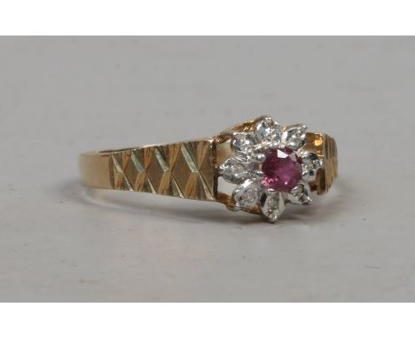 A 9ct gold ruby and diamond floriform ring, size T.