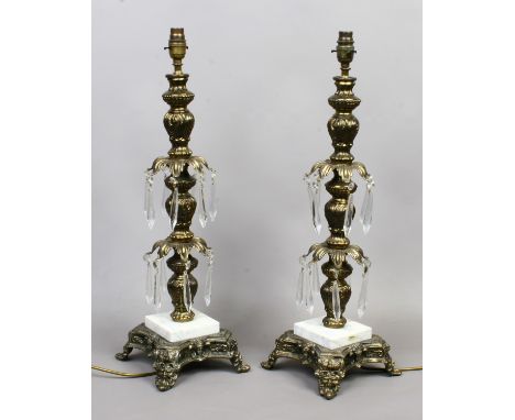 A large pair of mid 20th century gilt metal tablelamps of column form. With crystal droplets, raised on stepped marble plinth