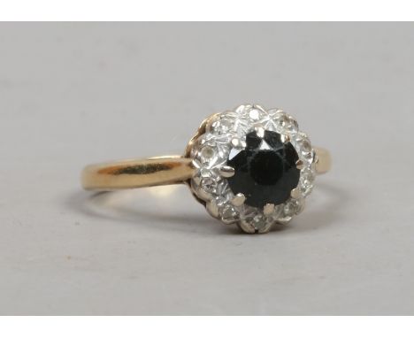 A 9 carat gold sapphire and diamond cluster ring, size M.