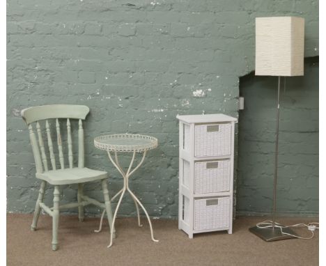 A painted steel occasional table and standard lamp, three basket storage rack and a green painted kitchen chair.
