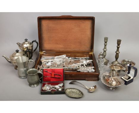 A collection of metalwares to include silver napkin ring, canteen of silver plated cutlery, Sheffield plate tea/coffee servic