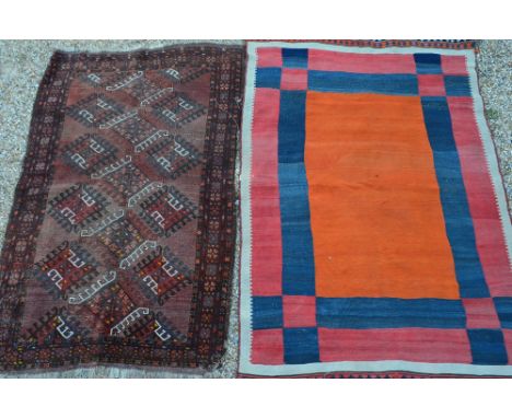 An old Morrocan kelim, orange/red to/w an antique Afghan carpet - worn (2)