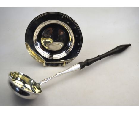 An Imperial Russian punch ladle with turned and ebonised handle, silver stem and oval bowl, 84 zol,.maker E R (backwards) Mos