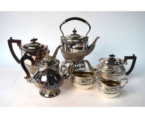 An epns three-piece tea service with chased decoration, to/w a half-reeded kettle on stand, a coffee pot and a tea pot of bal
