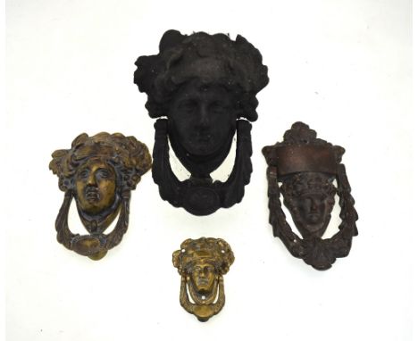 A Victorian cast iron Bacchanialian mask door knocker and three brass examples (4)