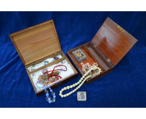 A box containing modern and vintage costume jewellery