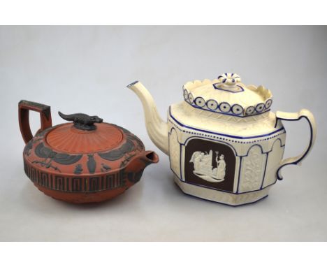 A Wedgwood red/brown basalt teapot and cover with Nile Crocodile finial, decorated with Ancient Egyptian motifs, 22cm wide; t