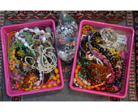 Two wooden boxes both containing a small quantity of vintage jewellery including bead necklaces, rings, brooches etc