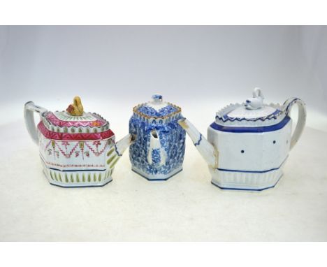 Three Staffordshire teapots and covers, comprising: one in blue and white with swan finial; one in red and green enamel with 