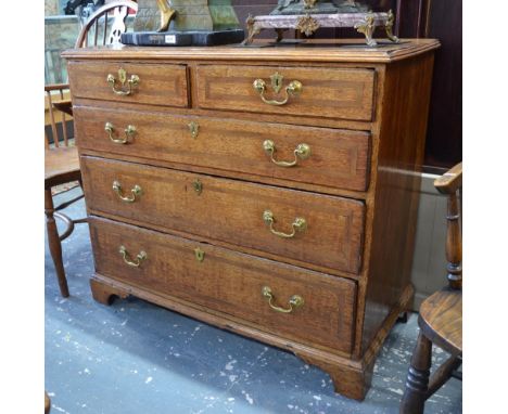 An 18th century cross-banded oak chest of two short over three long drawers with brass swan-neck fittings raised on shaped br