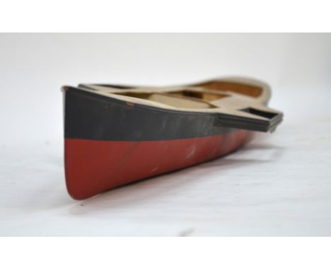 A vintage wooden pond-model hull of a Victorian paddle-steamer, incomplete