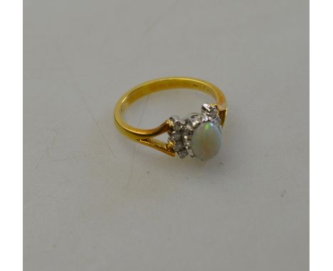 Opal and diamond cluster ring, 18ct yellow and white gold setting, in original box