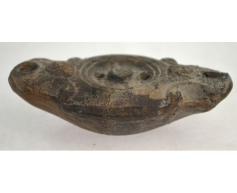 An antiquity terracotta double-ended oil lamp, to/w half a stone shabti and a miniature terracotta figure of a demon (3)