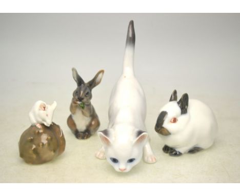 Three Royal Copenhagen models - Rabbit, no 4705; Rabbit, no 1019; Mouse on chestnut, no 511 and a Bing & Grondahl model of a 