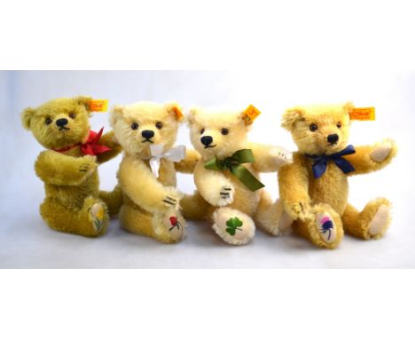 Four Steiff mohair teddy bears, each with a footpad embroidered with either a daffodil, rose, shamrock or thistle, 20 cm high