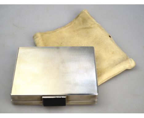 An Art Deco engine-turned silver compact, the gilt interior fitted with compartments for powder, cigarettes, lipstick and com