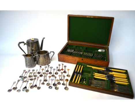 An oak canteen containing a set of OEP flatware, to/w an engraved three-piece tea service and a collection of souvenir teaspo