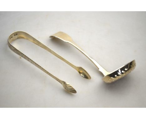 A pair of Georgian bright-cut silver sugar tongs with shell bowls, maker J.S., Dublin (no date), to/w a George IV fiddle patt