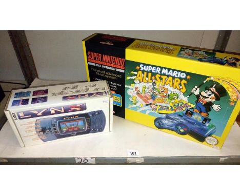 A boxed Atari Lynx portable colour system (no power lead) a boxed Super Mario All Stars Super Nintendo (box & console only, n
