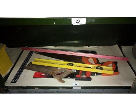 A quantity of tools including levels & saws etc,