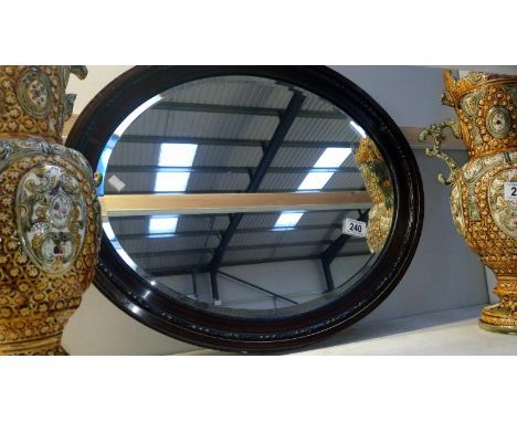 A vintage oval mirror