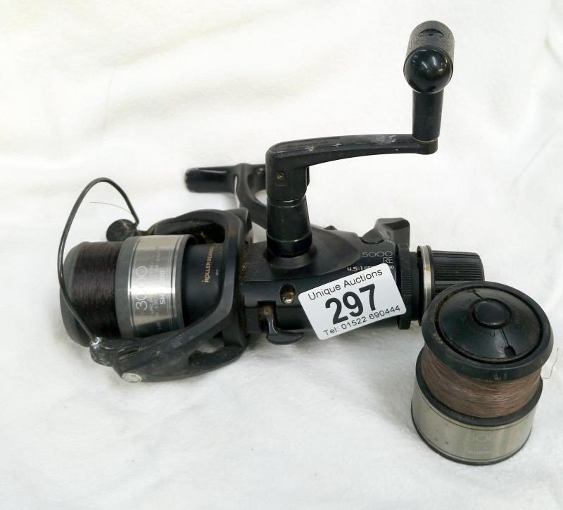 A Shimano Baitrunner aero fishing reel with 3000 & 5000 line cap