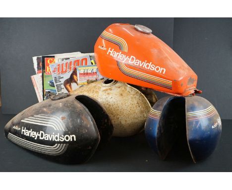 Four Harley Davidson petrol tanks, 1980s AMF (af) together with a few motorcycling magazines 