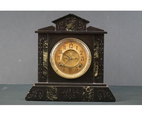 An antique French slate mantle clock with brass dial. 