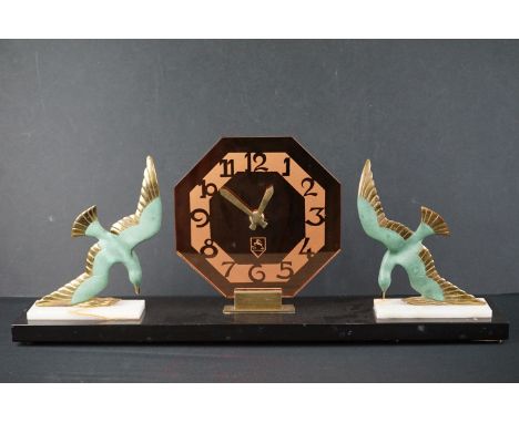 Art Deco Mantle Clock with amber mirrored glass octagonal dial flanked either side by metal seagulls / birds held on onyx pli