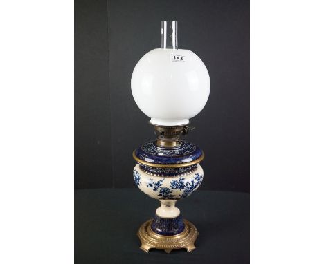 Taylor Tunnicliffe cream and dark blue ceramic Oil Lamp with drop-in font and brass base, Messengers burner and globular opaq