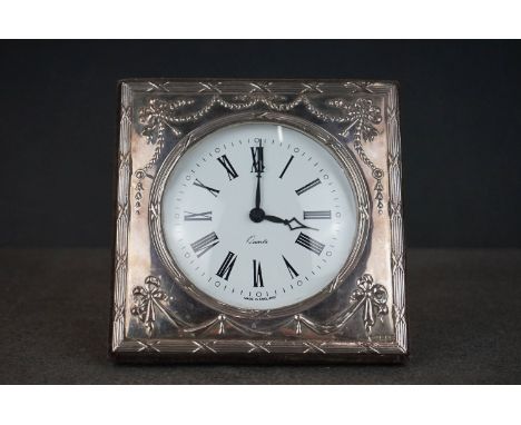 A fully hallmarked sterling silver fronted easel back quartz desk clock. 