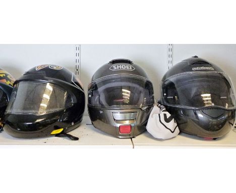 Schuberth limited edition carbon-fibre crash helmet, a Shoei safety helmet, a vintage Bell Super Magnum crash helmet together