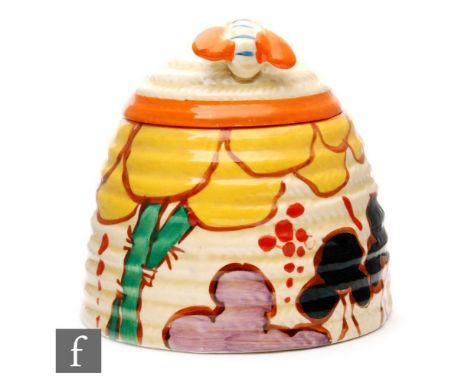 A Clarice Cliff Summerhouse large size beehive honey pot circa 1932, hand painted with a stylised garden scene with tree and 