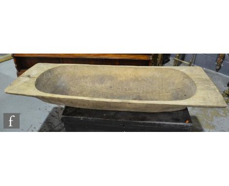 A 19th Century elm dough trough, width 52cm,  length 150cm 