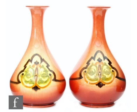 A pair of 19th Century Ault Pottery vases, each of pear form, terminating at a flared upper rim, the graduated red/yellow gro