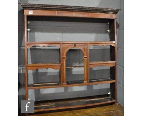 An early 19th Century small inlaid delft rack the arched central shelf below a dentil cornice, height 105cm x width 102cm. 