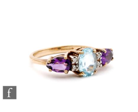 A 9ct hallmarked amethyst, diamond and blue topaz seven stone ring, claw set stones to knife edged shoulders, ring size K. 