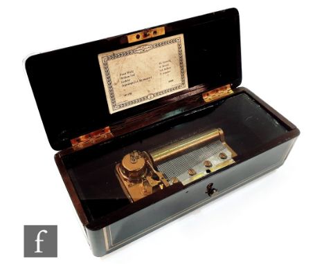 An early 19th Century boulle work tortoiseshell glove box, fitted with a later musical box playing four airs and tune card, w