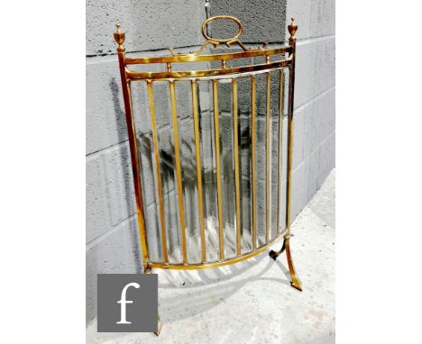 An Edwardian brass concave floorstanding firescreen, beveled glass panels, on splayed end legs, width 46cm. 