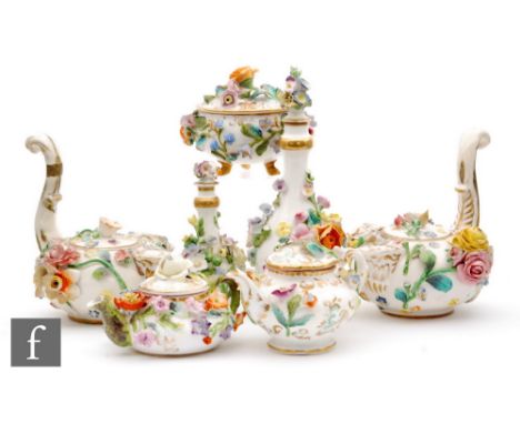 A collection of assorted late 19th Century floral encrusted wares comprising two scent bottles, two miniature teapots, a trin