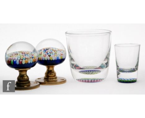 A collection of Perthshire glass to comprise two door knobs, a whisky tumbler and a shot glass, all decorated with millefiori