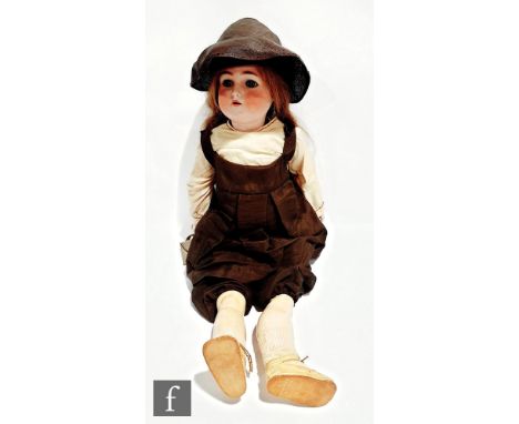 An early 20th Century Simon &amp; Halbig / Kammer &amp; Reinhardt bisque head child doll, the socket head with sleeping blue 