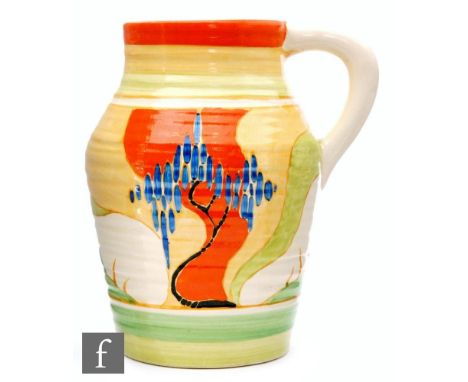 A Clarice Cliff Windbells pattern small single handled Lotus jug circa 1932, hand painted with a stylised tree landscape with