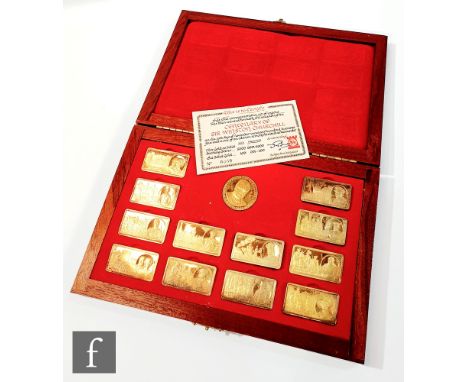 A set of 12 silver gilt ingots for the Centenary of Sir Winston Churchill, with medallion and certificate in teak case. (13) 