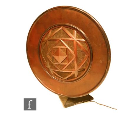 An Art Deco 1920s/30s Bakelite speaker, the circular speaker rising from a triform pedestal base, with geometric grill, marke