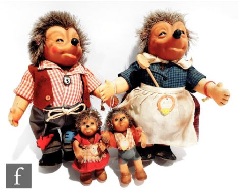 A Steiff hedgehog family, Mecki with wrist tag, height 25cm, Micki with chest tag and wrist tag, Mucki with chest tag and Mac